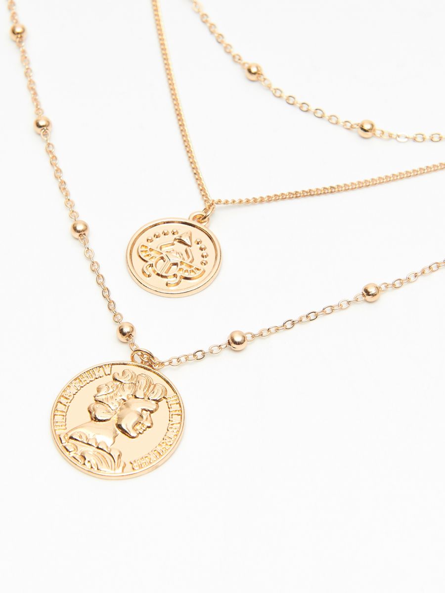 Layered necklace with coin pendants 
