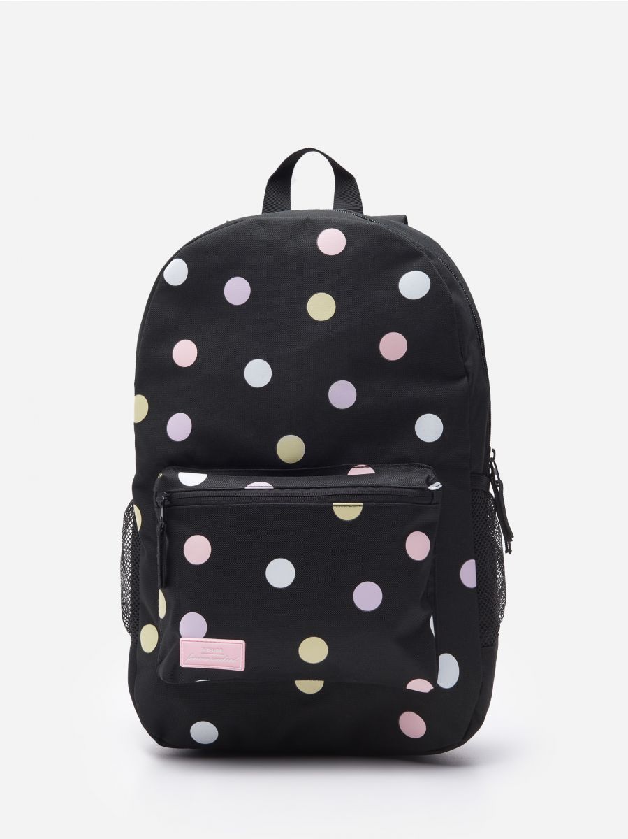 black polka dot backpack