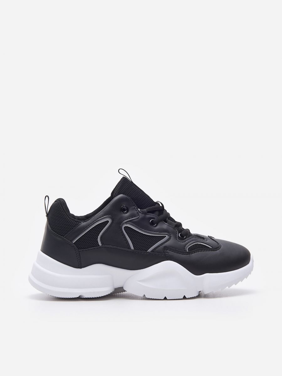 thick sole black trainers